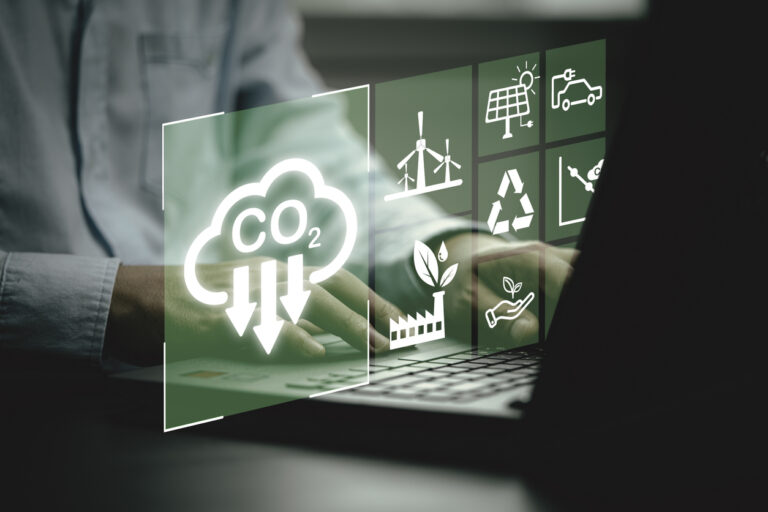 Business using laptop with CO2 reducing icon for new business manage decrease CO2 , carbon footprint and carbon credit to limit global warming from climate change, Bio Circular Green Economy concept.